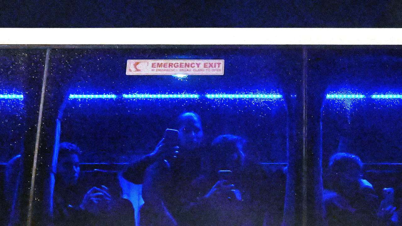 Iranian players film supporters blocking the bus on their departure following the AFC Women's Asian Cup Group A match between Iran and Philippines at Gold Coast Stadium