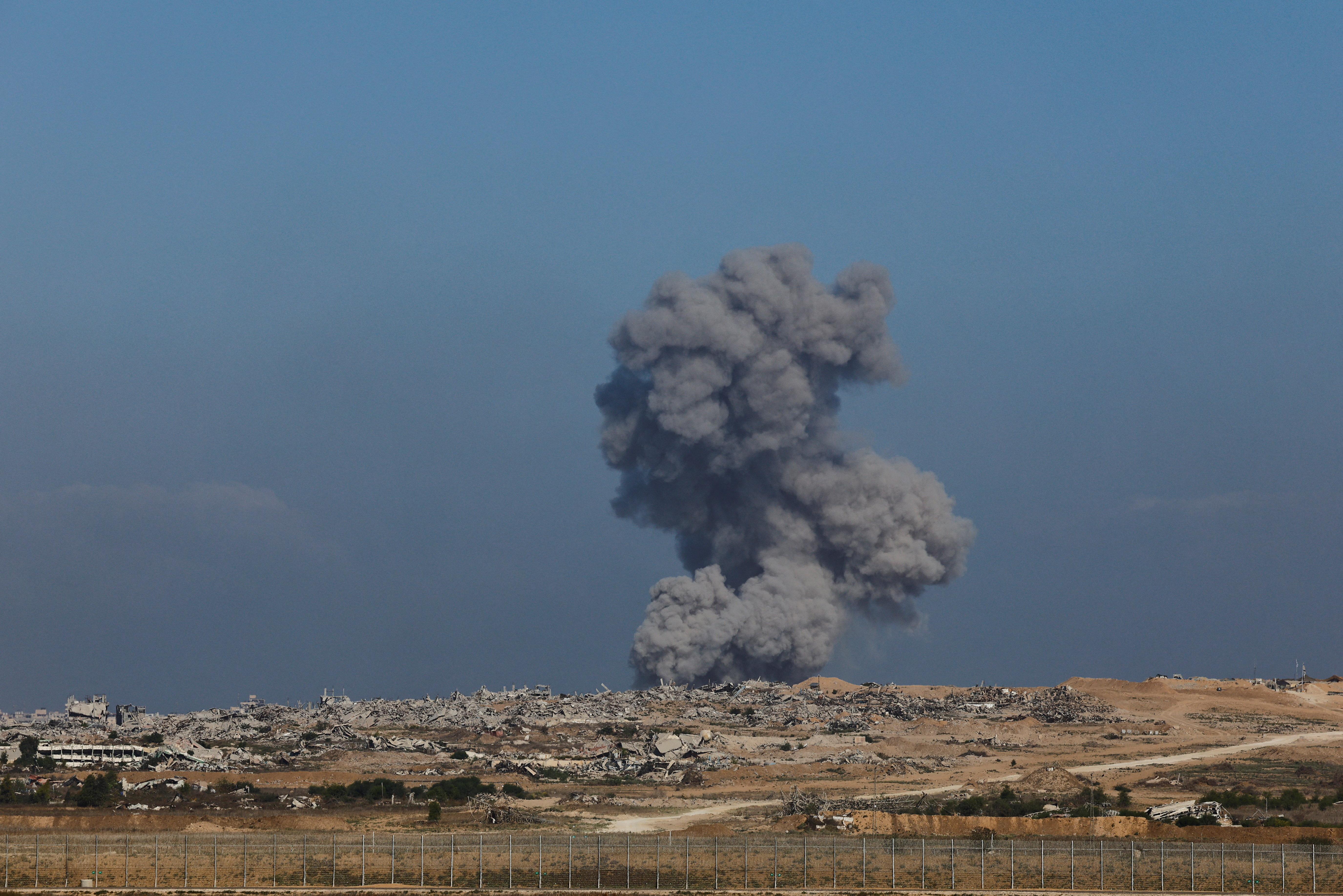Smoke rises from Gaza after an explosion, as seen from the Israeli side of the border