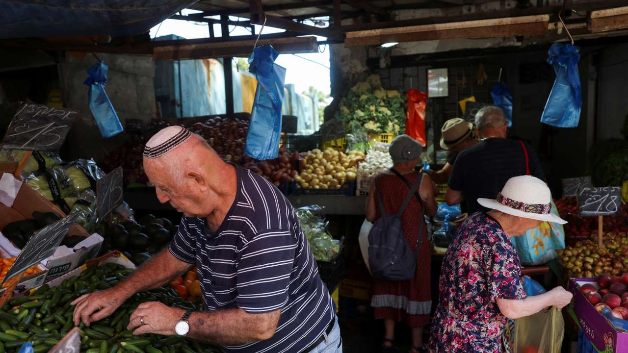 People shop in a market, amid rising tensions between Israel and Hezbollah, in Haifa