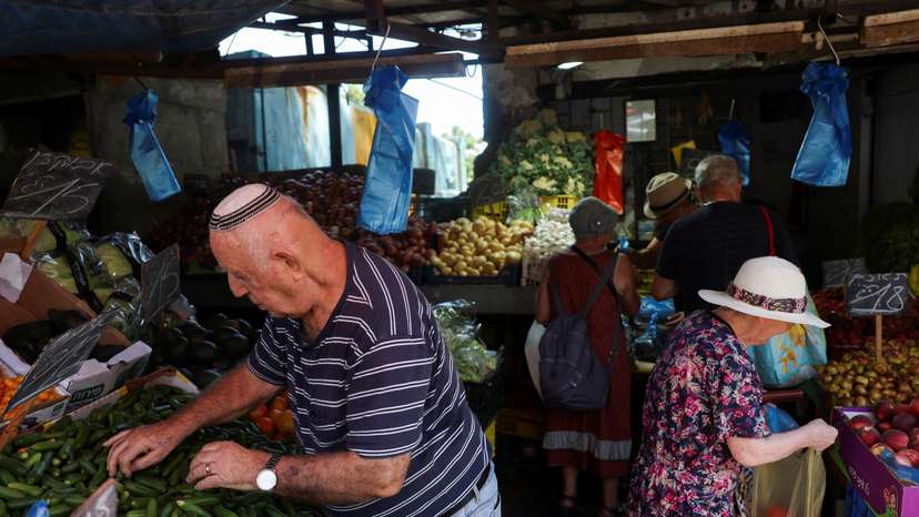 People shop in a market, amid rising tensions between Israel and Hezbollah, in Haifa