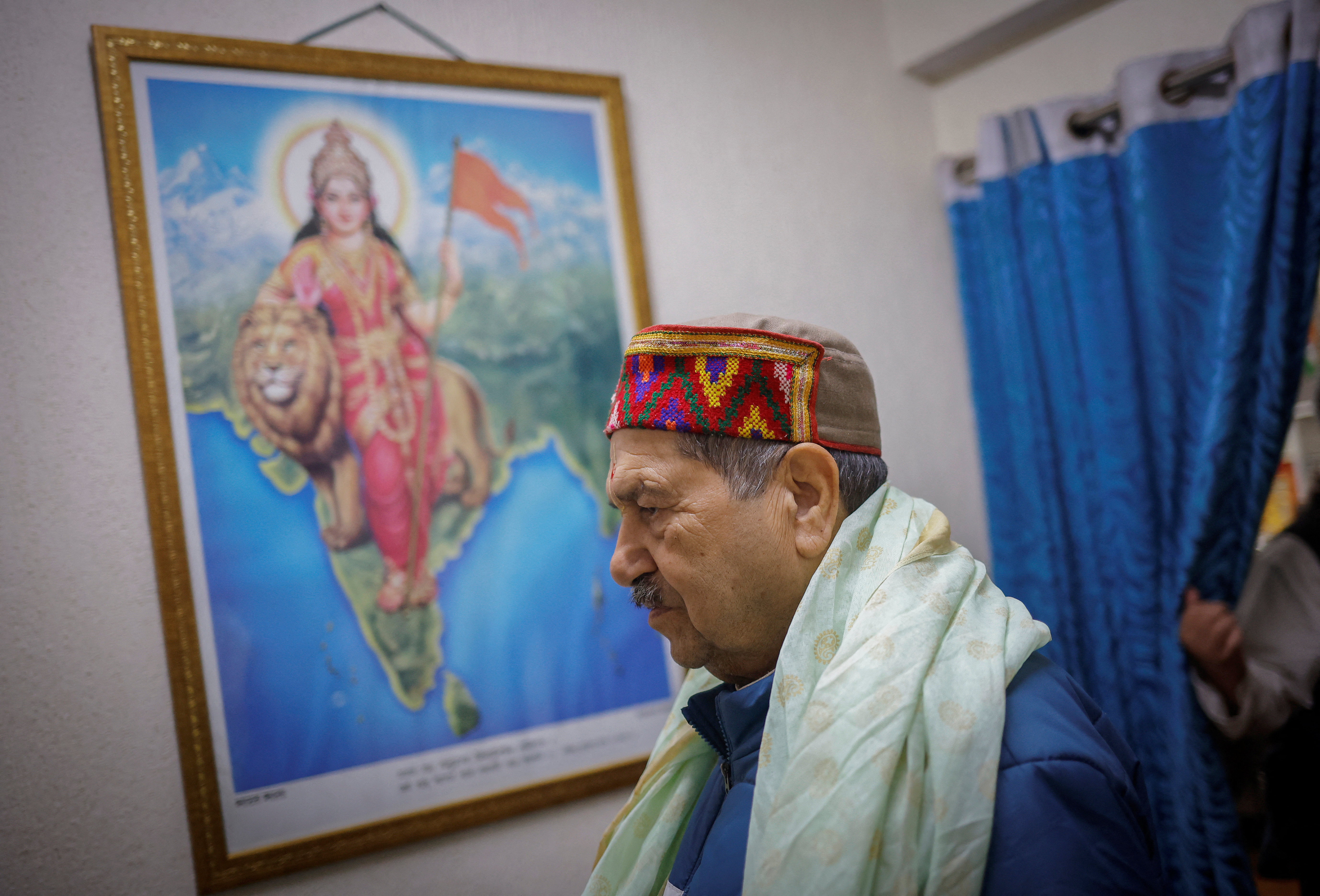 Indresh Kumar, a senior leader of the RSS arrives at his office in New Delhi