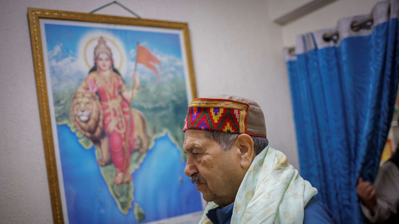Indresh Kumar, a senior leader of the RSS arrives at his office in New Delhi