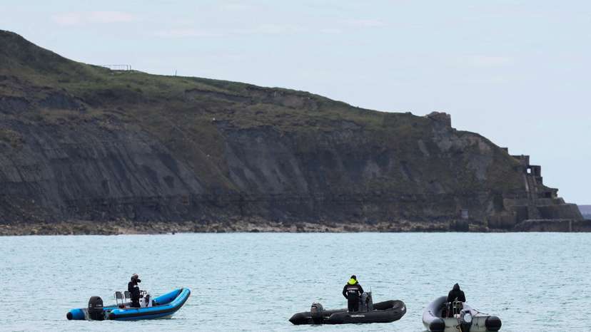 Security and rescue forces are seen on the beach of Wimereux, near Calais