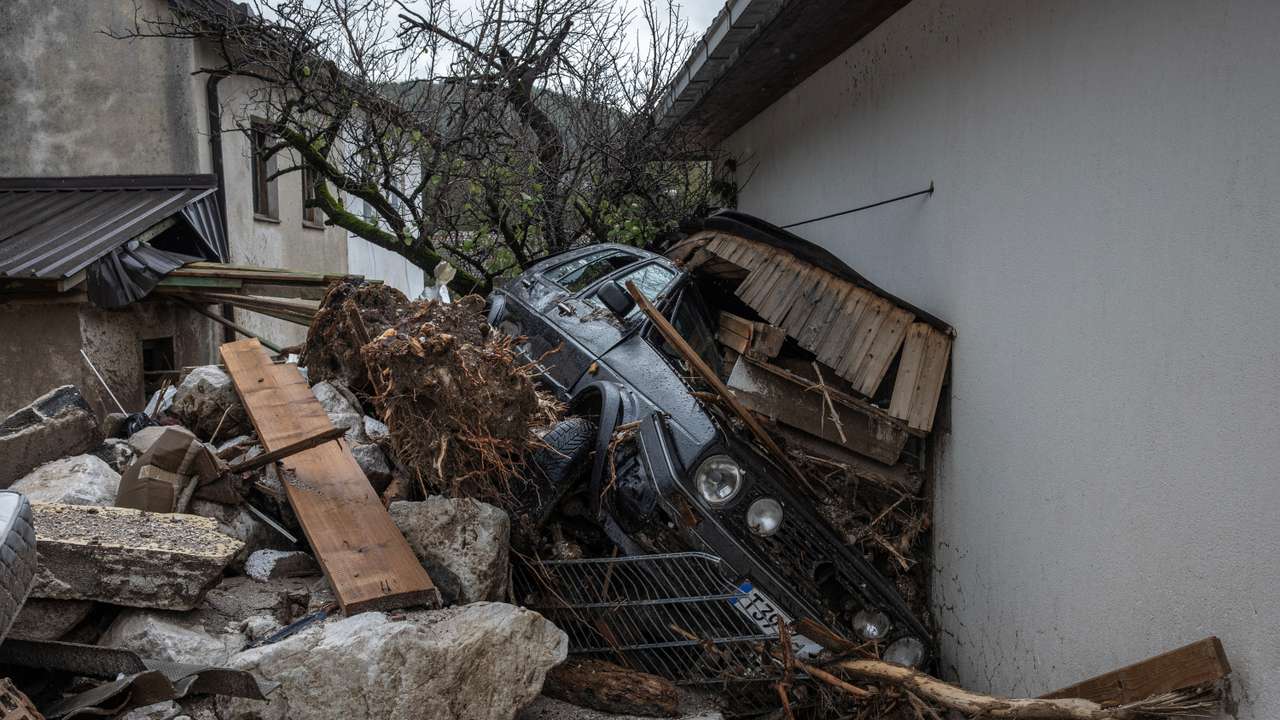 A destroyed car is seen following a landslide in the flooded village of Donja Jablanica