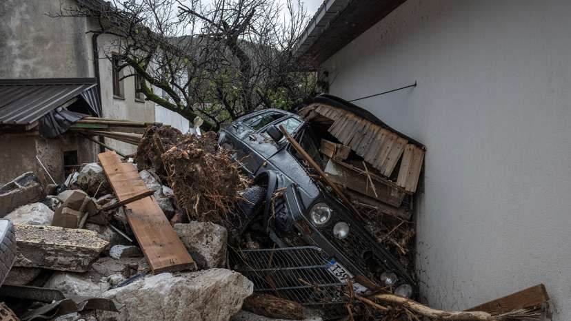 A destroyed car is seen following a landslide in the flooded village of Donja Jablanica