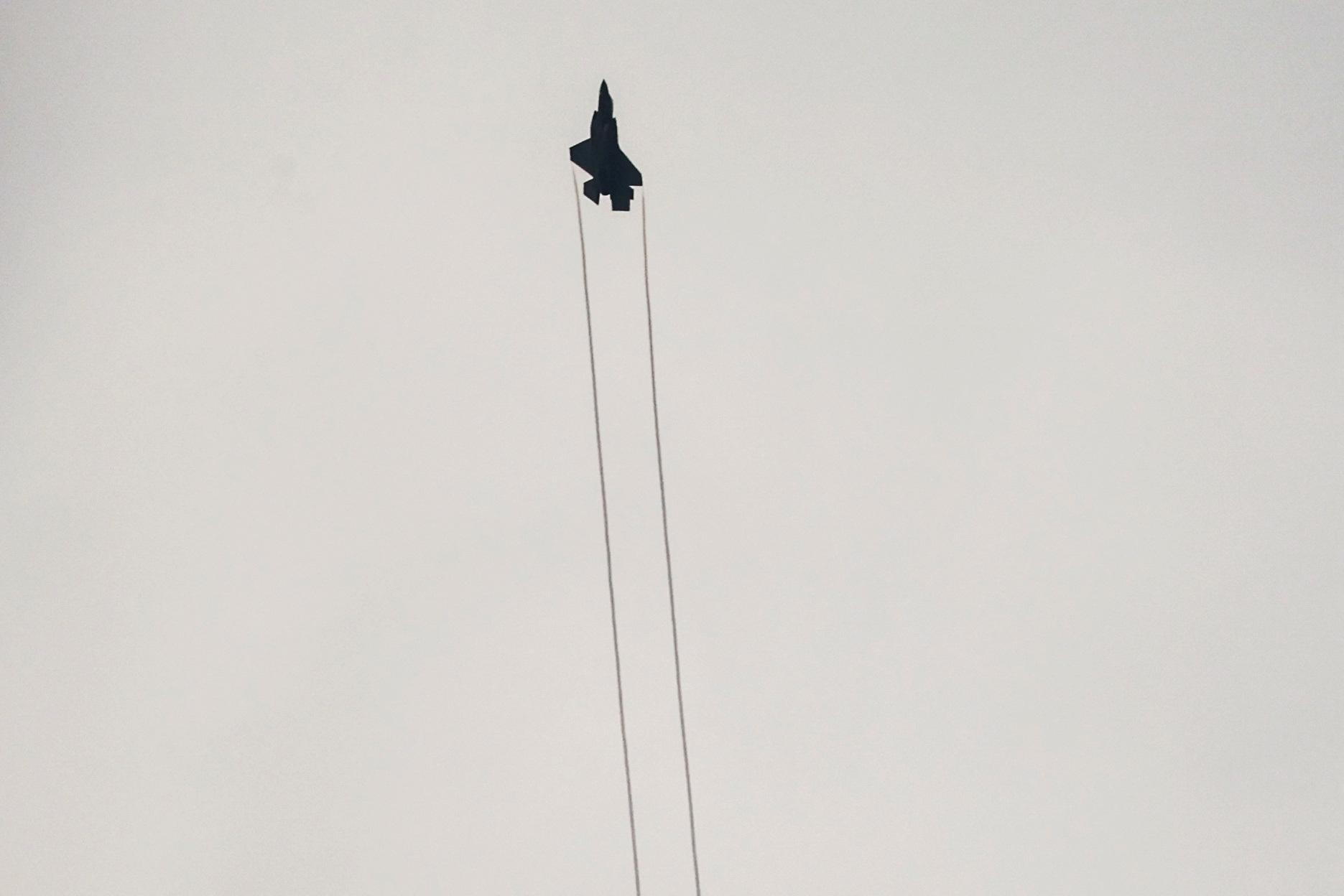 An Israeli F-35 combat aircraft is seen in the skies over Israel's border with Lebanon, in northern Israel