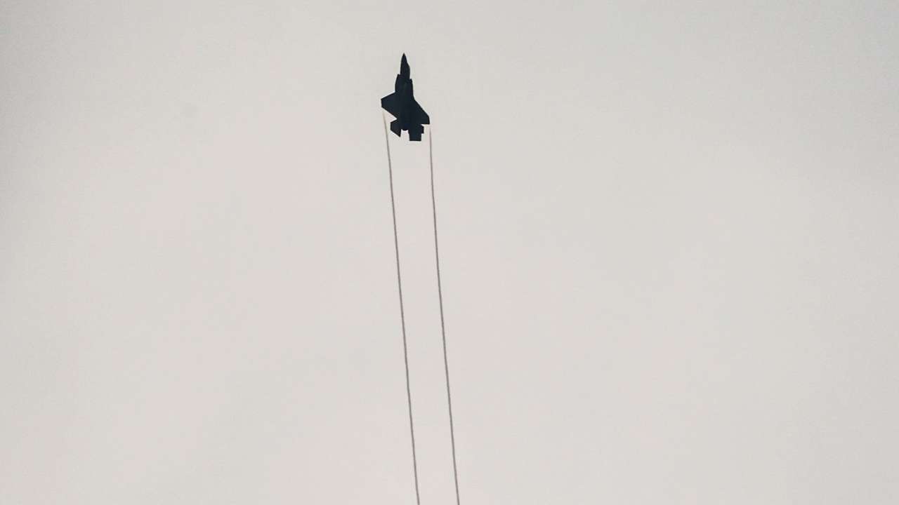 An Israeli F-35 combat aircraft is seen in the skies over Israel's border with Lebanon, in northern Israel