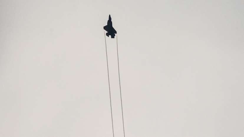 An Israeli F-35 combat aircraft is seen in the skies over Israel's border with Lebanon, in northern Israel