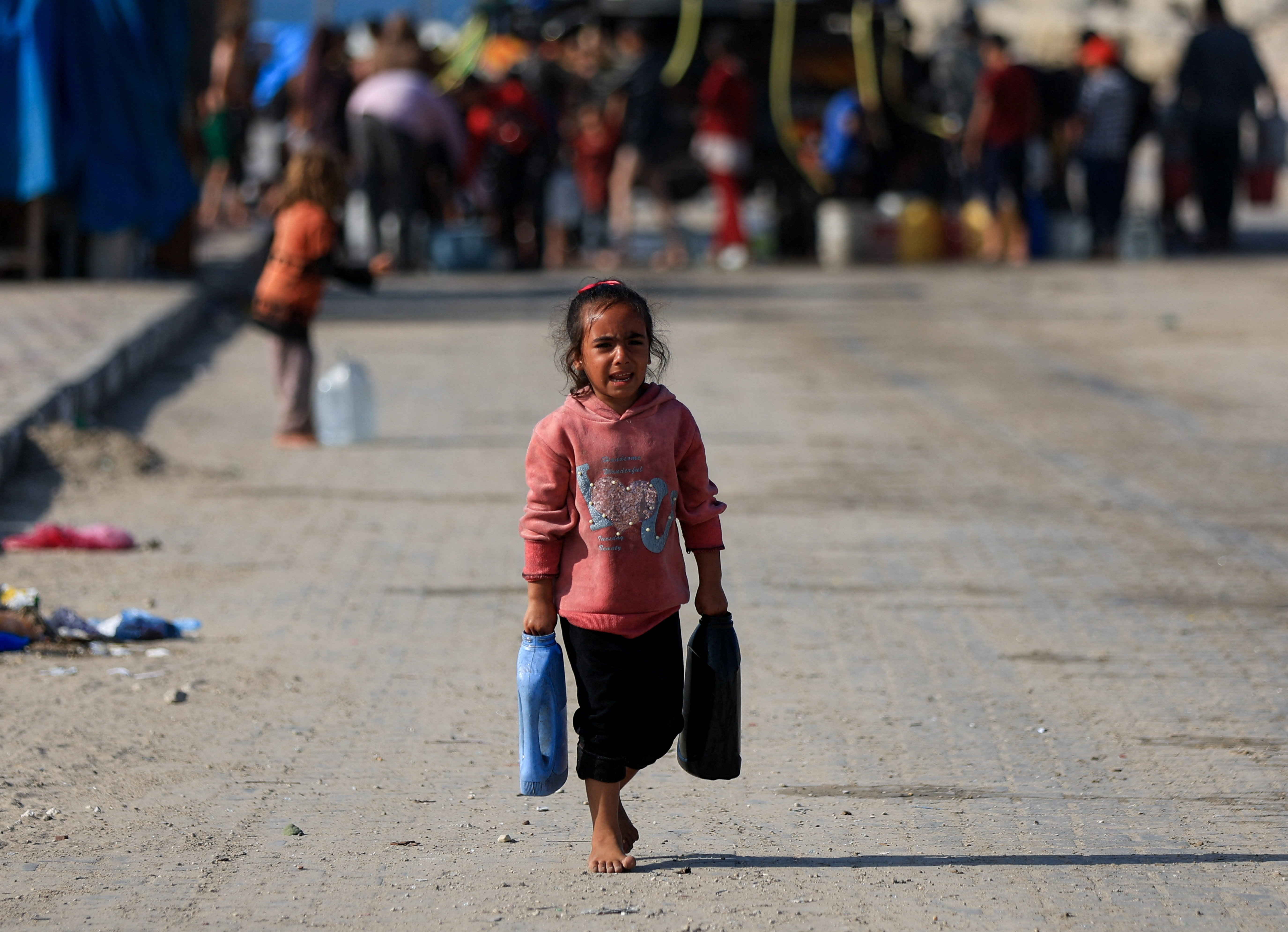 Palestinians gather to collect water, Gaza City