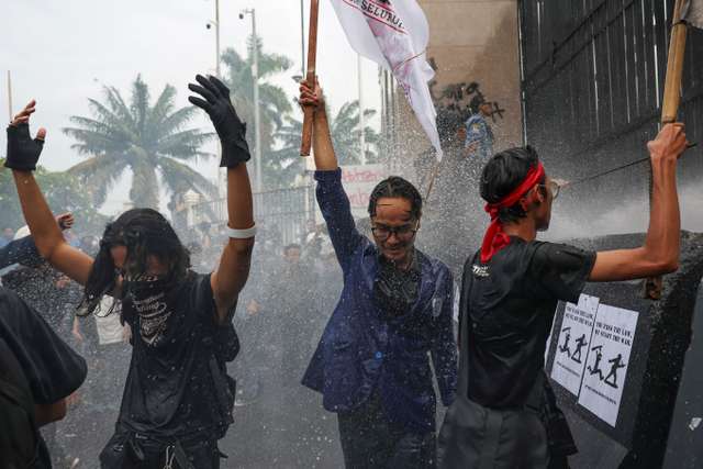Protest outside the Indonesian Parliament against revisions to the country's military law, in Jakarta