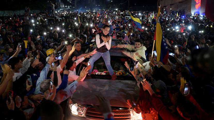 FILE PHOTO: Venezuelan opposition leader Maria Corina Machado greets supporters