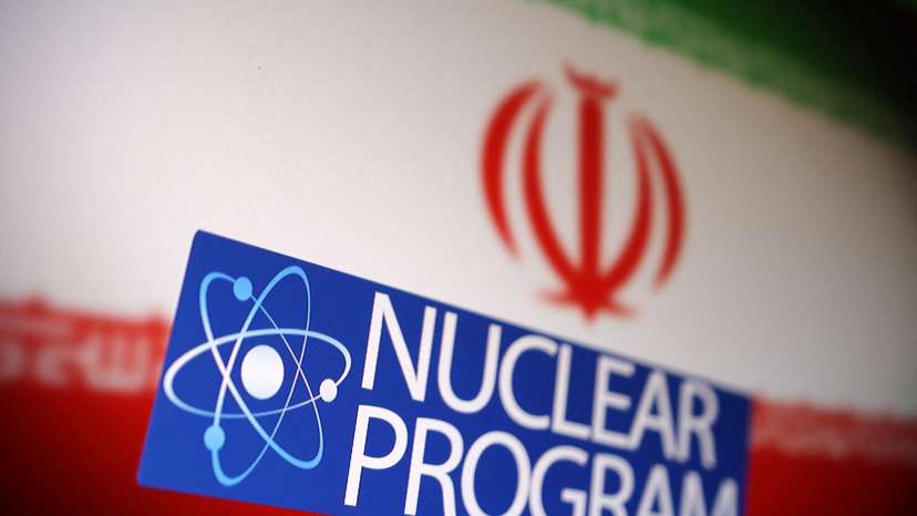Illustration shows Iranian flag, atom symbol and words "Nuclear program\
