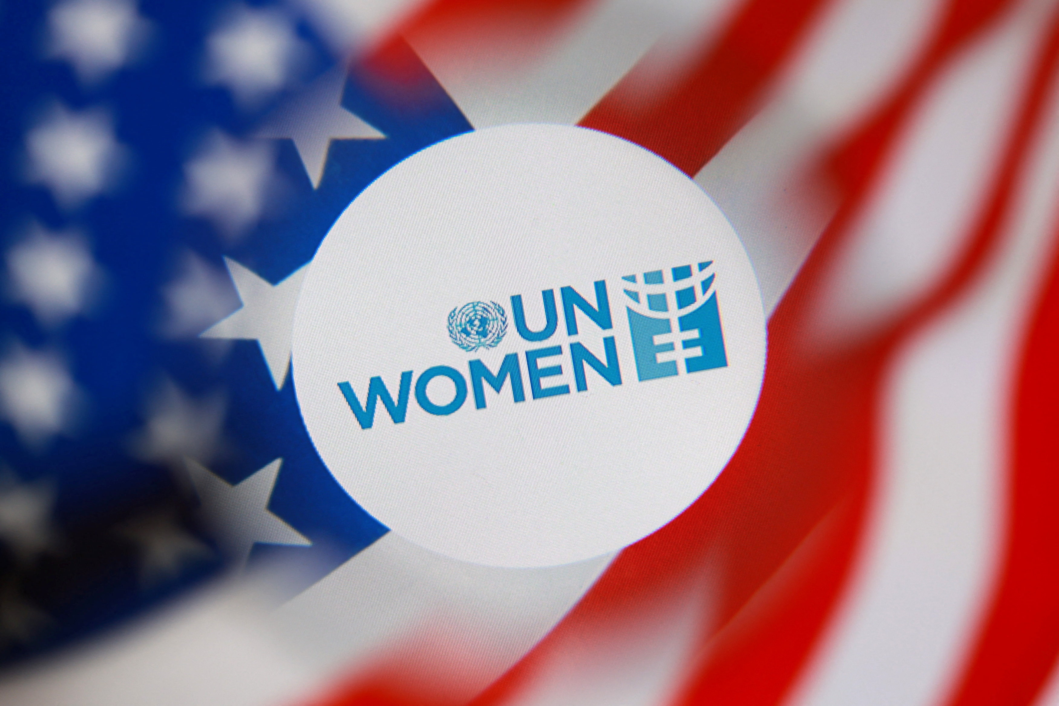 Illustration shows UN WOMEN logo and U.S. flag