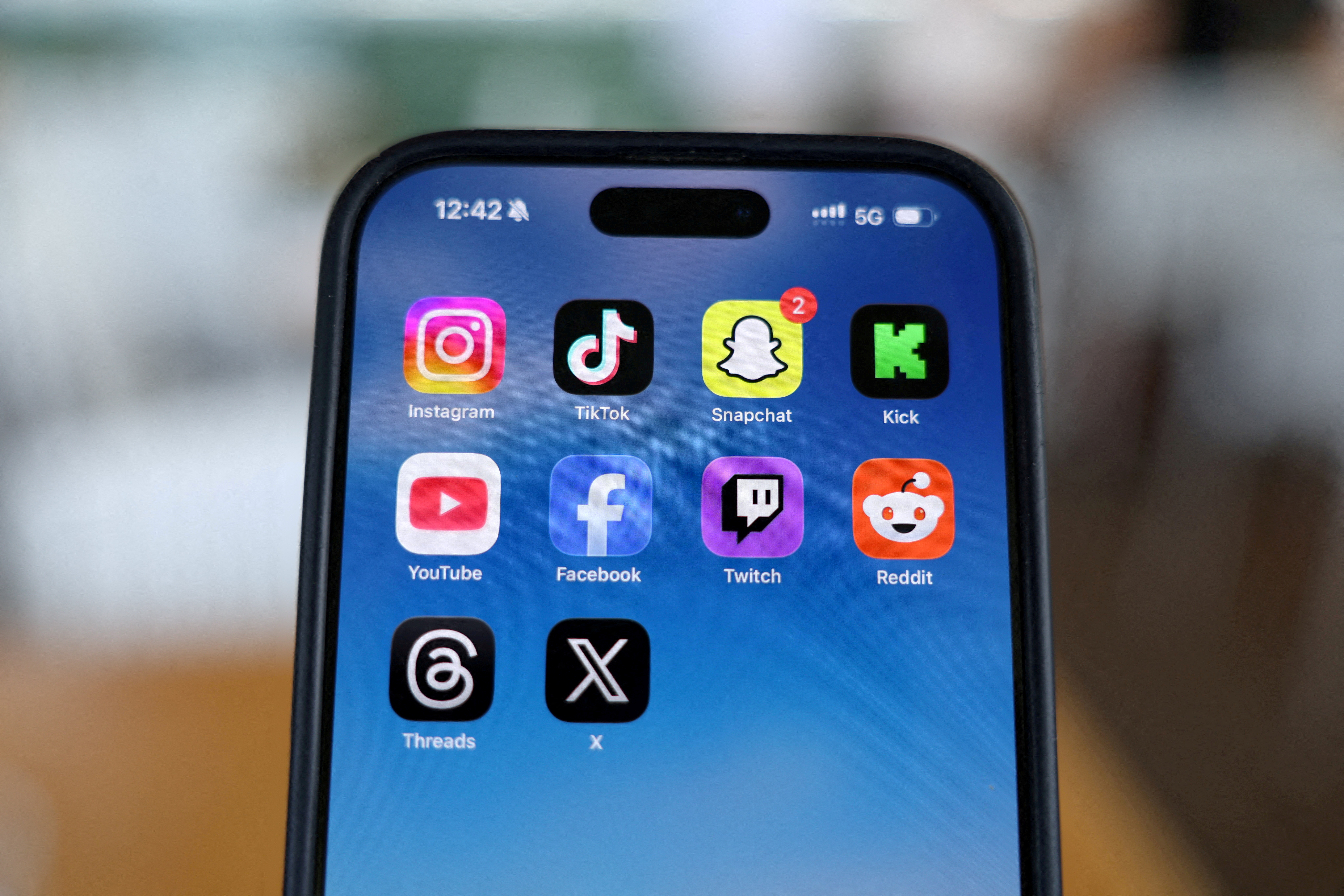 FILE PHOTO: Social media apps are displayed on a mobile phone