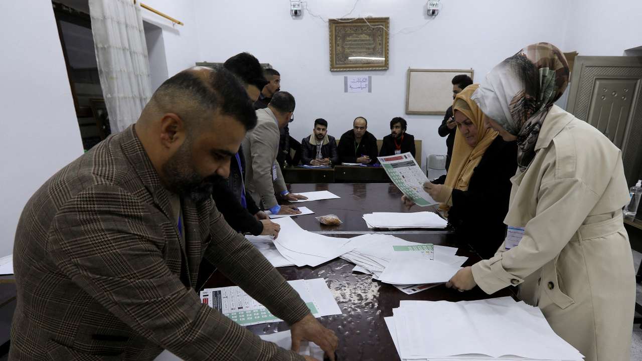 FILE PHOTO: Officials sort ballot papers after the closing of the polling station during Iraq's provincial council elections, in Kirkuk