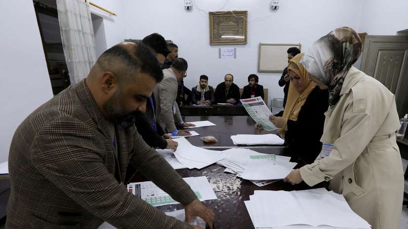 FILE PHOTO: Officials sort ballot papers after the closing of the polling station during Iraq's provincial council elections, in Kirkuk