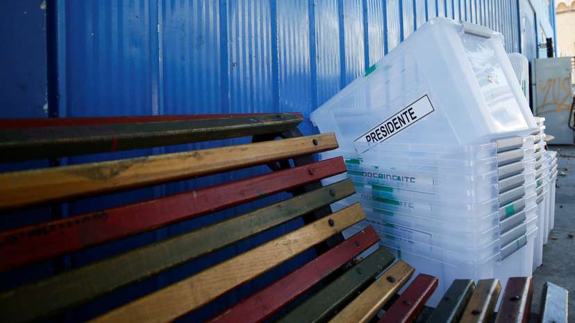 Ballot boxes are stacked at a polling station in Valparaiso