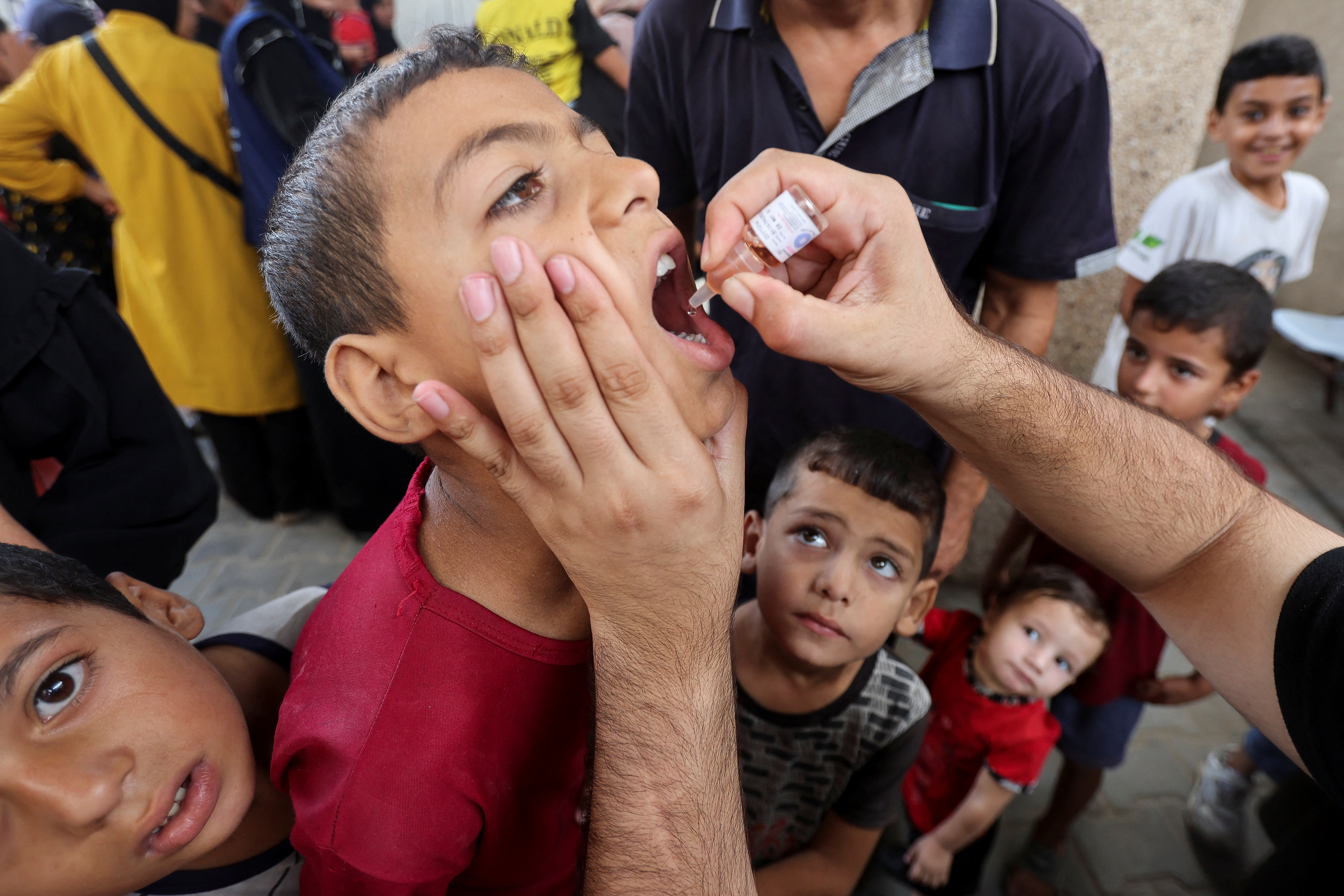 Palestinian children are vaccinated against polio, in Deir Al-Balah in the central Gaza Strip