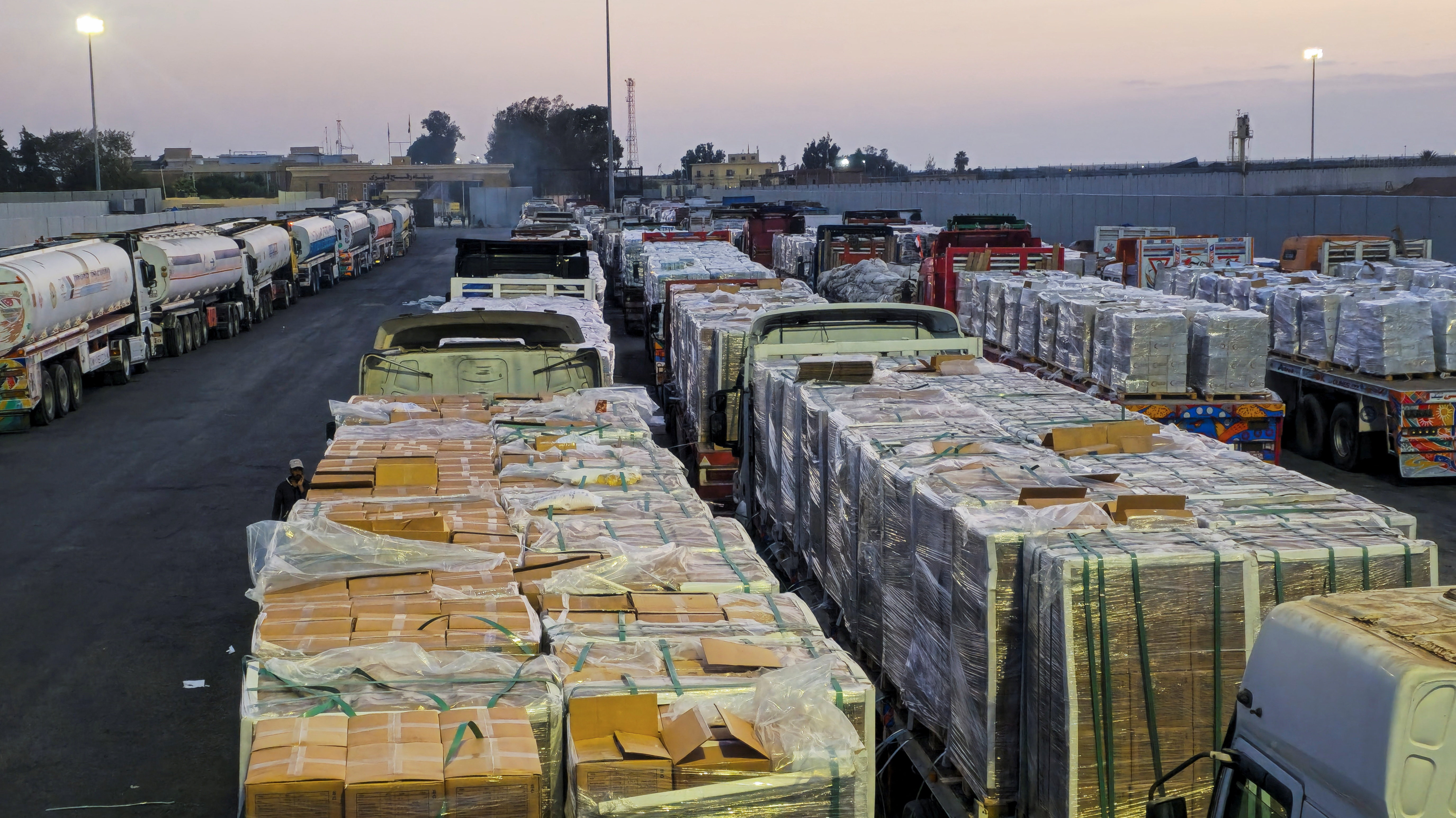 Trucks carrying humanitarian aid and fuel at the Rafah border on the Egypt side