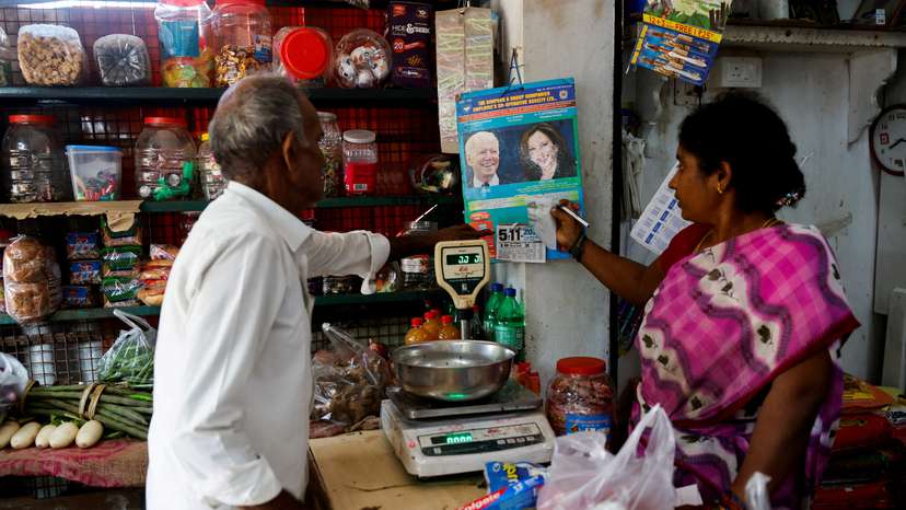 A calendar with images of U.S. President Joe Biden and Democratic presidential nominee, U.S. Vice President Kamala Harris is hung inside a shop in Thulasendrapuram
