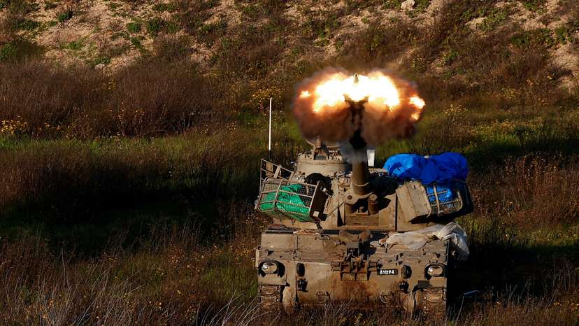 An Israeli artillery unit fires towards Gaza, near the northern Gaza Strip border