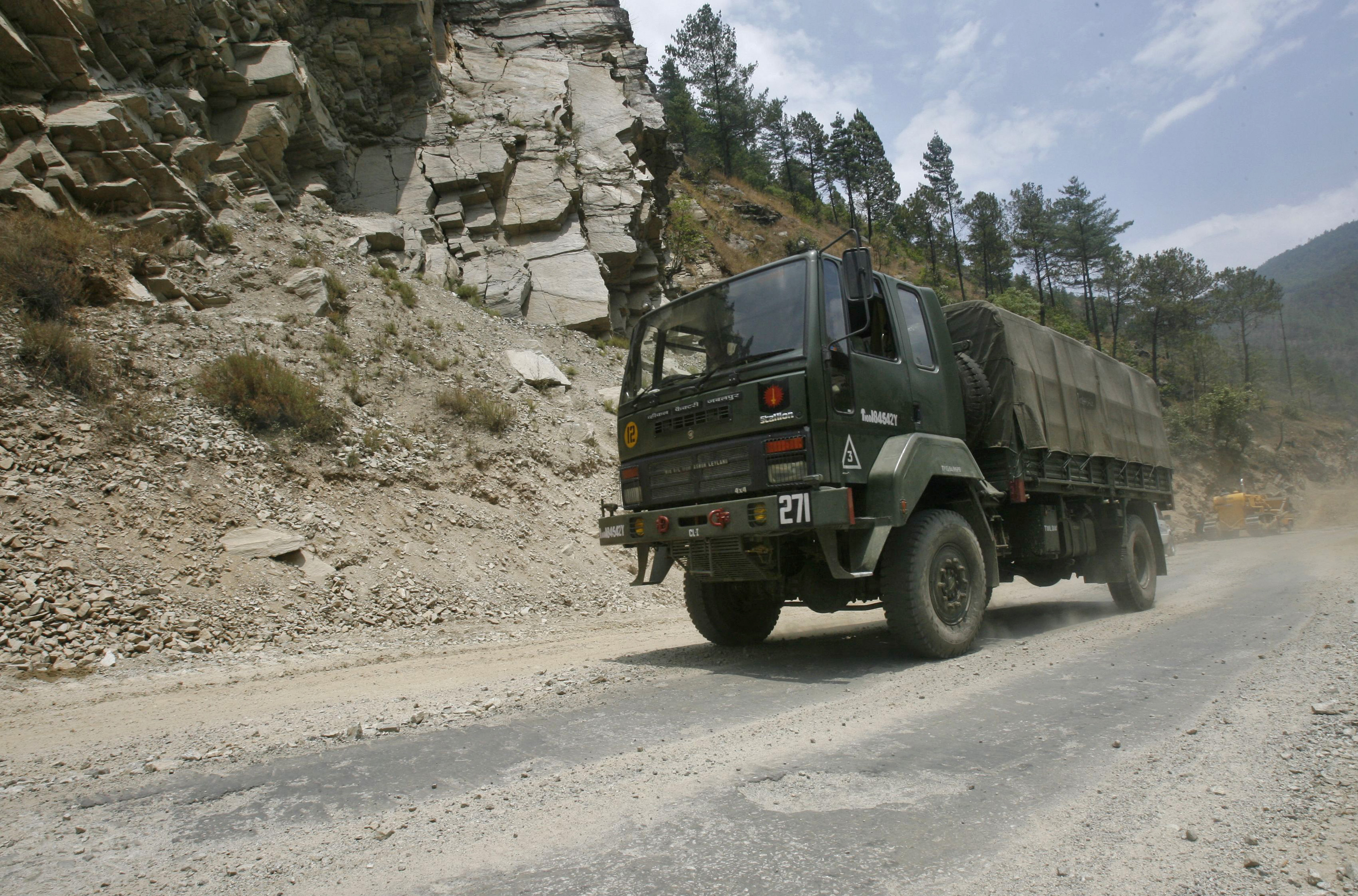 An Indian army truck drives along India's Tezpur-Tawang highway, which runs to the Chinese border, in the northeastern Indian state of Arunachal Pradesh