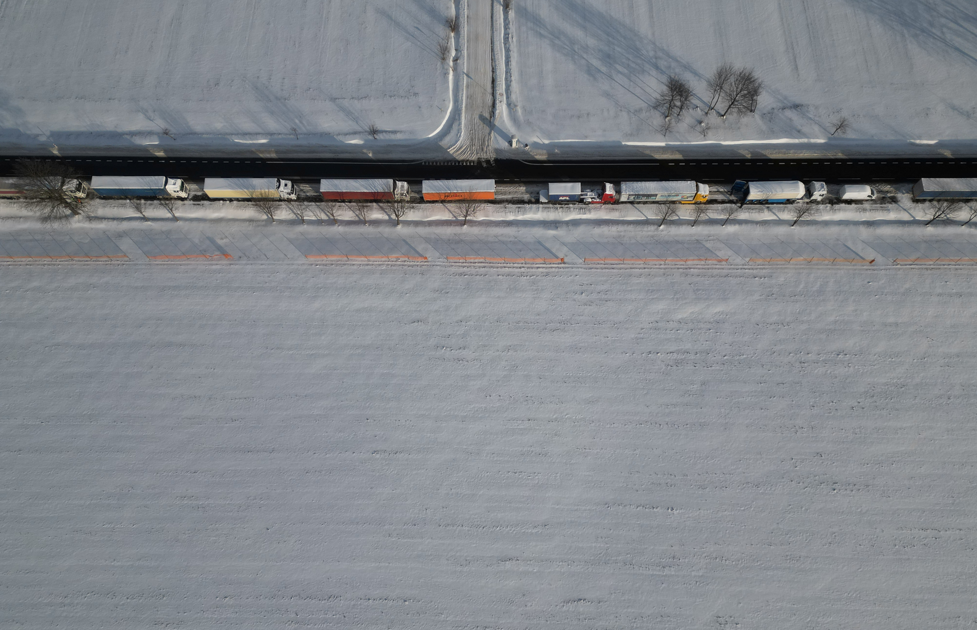 Trucks line up in a long queue to cross the Polish-Ukrainian border at the Hrebenne-Rawa Ruska crossing in Potoki