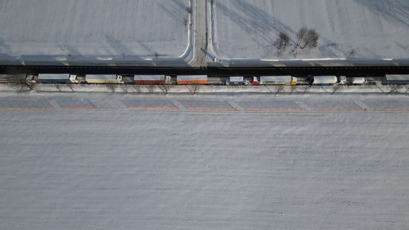 Trucks line up in a long queue to cross the Polish-Ukrainian border at the Hrebenne-Rawa Ruska crossing in Potoki