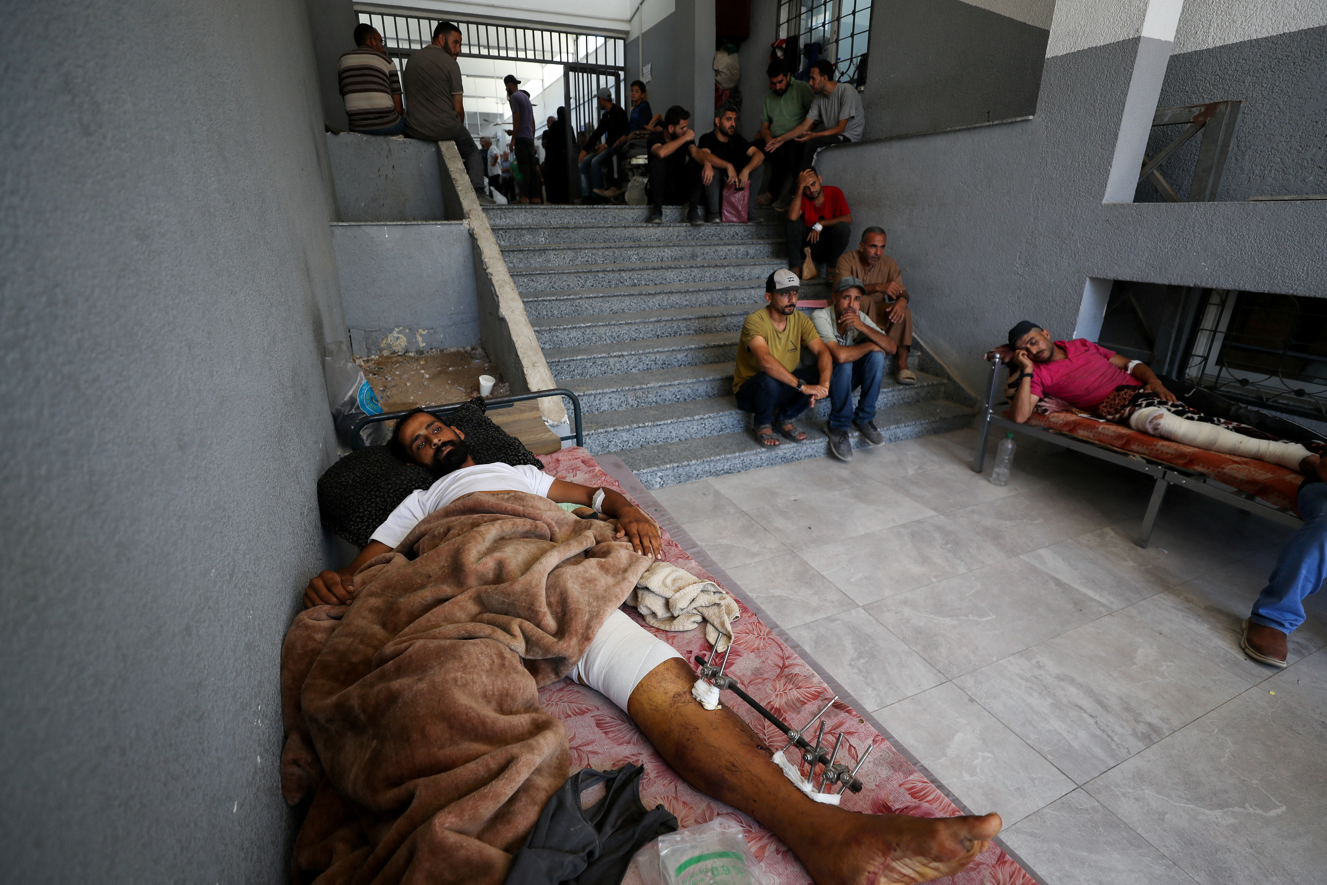 Wounded Palestinians rest at Al-Shifa Hospital, in Gaza City