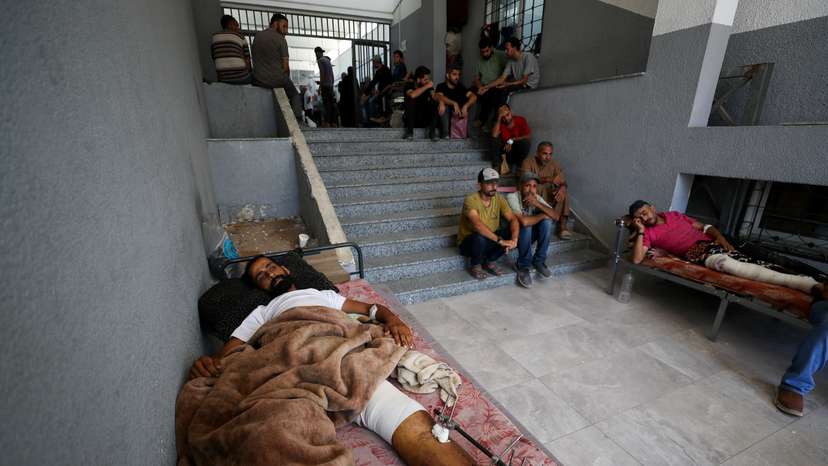 Wounded Palestinians rest at Al-Shifa Hospital, in Gaza City