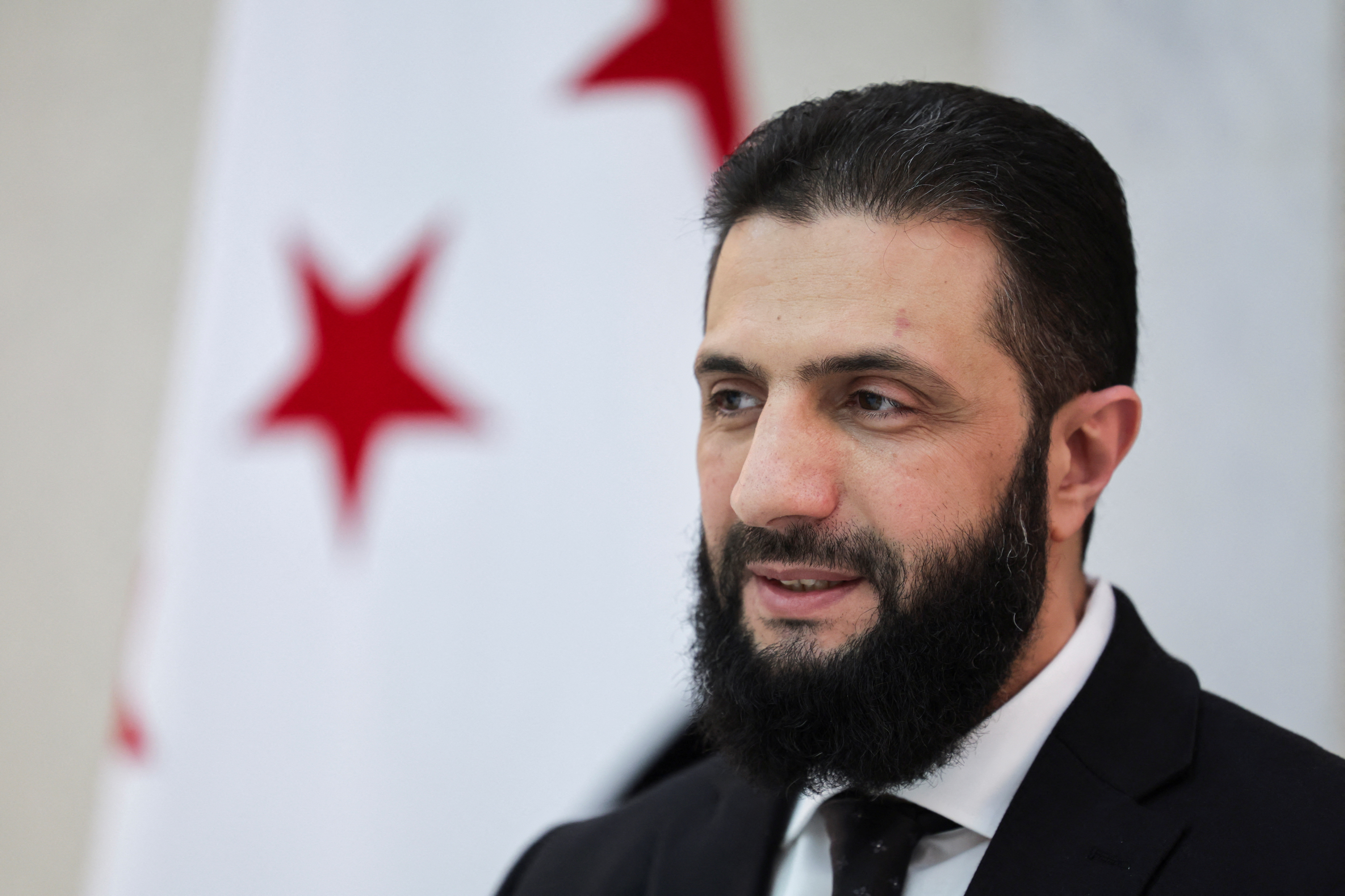 Syria’s interim President Ahmed al-Sharaa attends an interview with Reuters