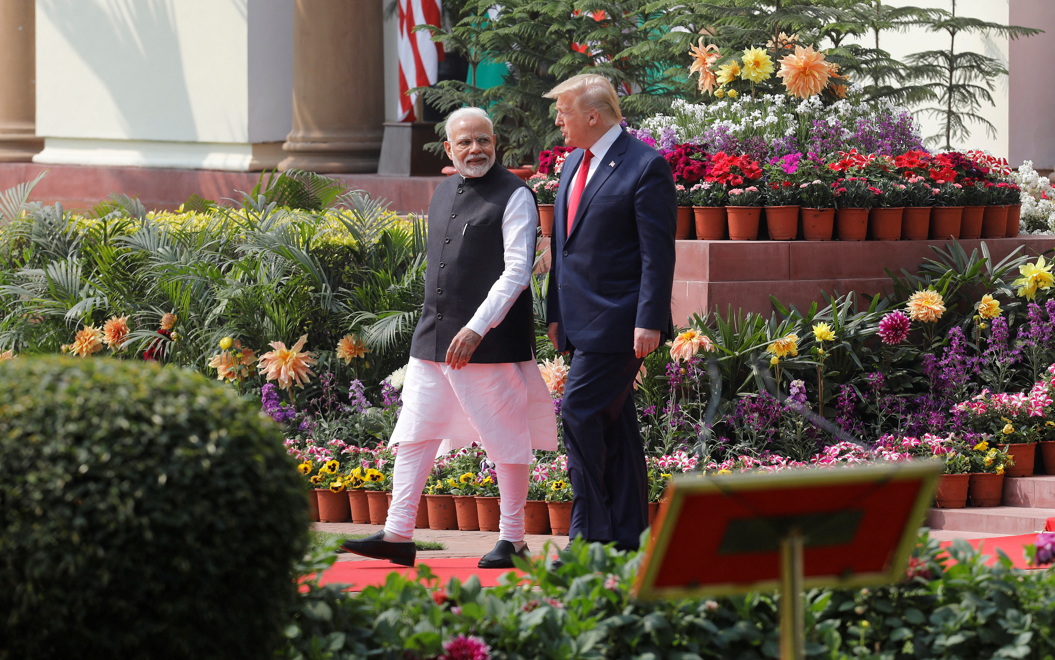 FILE PHOTO: U.S. President Donald Trump and India's Prime Minister Narendra Modi arrive for their joint news conference at Hyderabad House in New Delhi