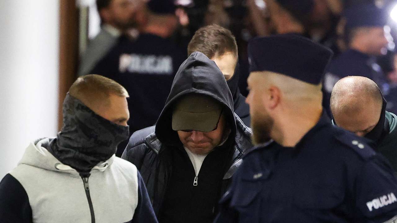 A Ukrainian diver, Volodymyr Z., wanted by Germany over his alleged involvement in the 2022 explosions that damaged the Nord Stream pipeline, walks escorted by Polish Police at the district court