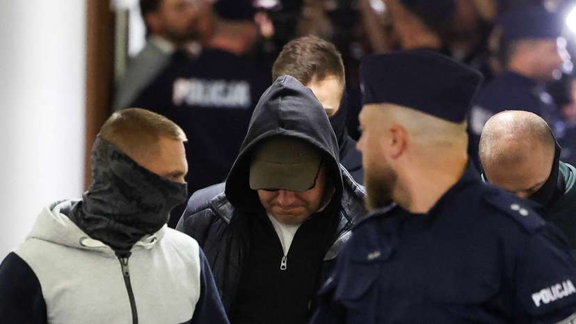 A Ukrainian diver, Volodymyr Z., wanted by Germany over his alleged involvement in the 2022 explosions that damaged the Nord Stream pipeline, walks escorted by Polish Police at the district court