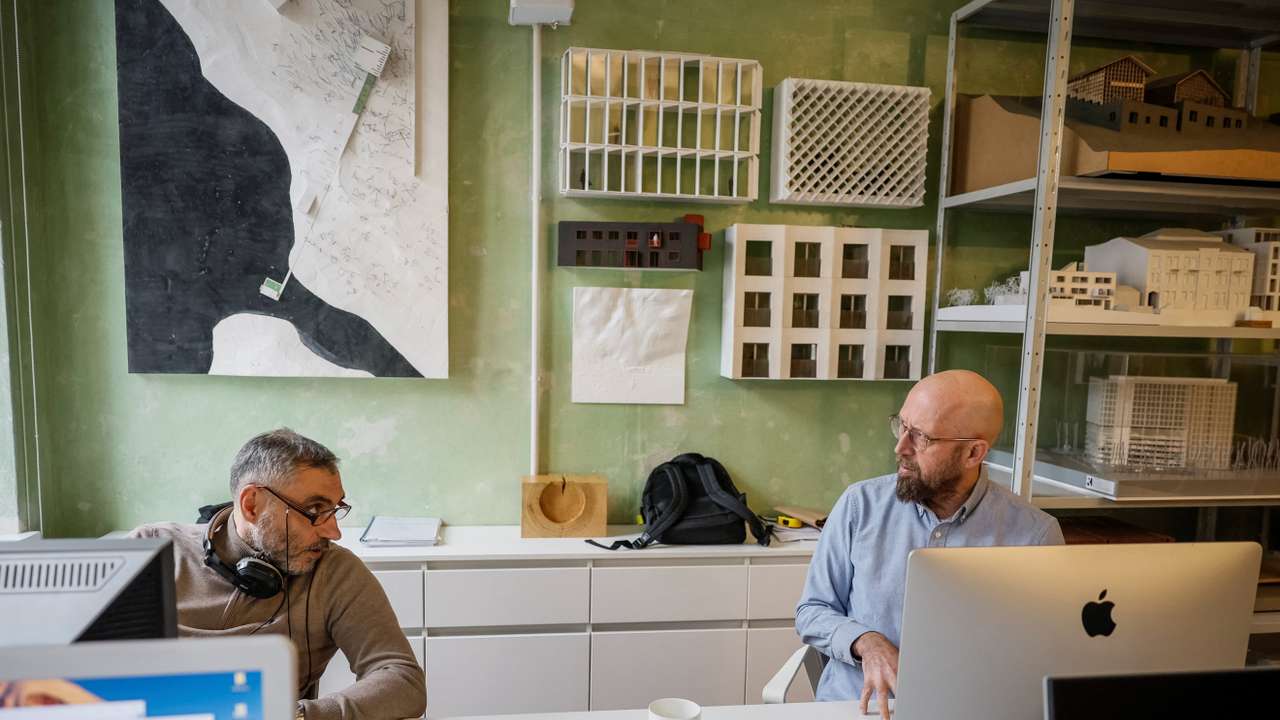 Architects from Kharkiv sit in their reopened office, in Lviv