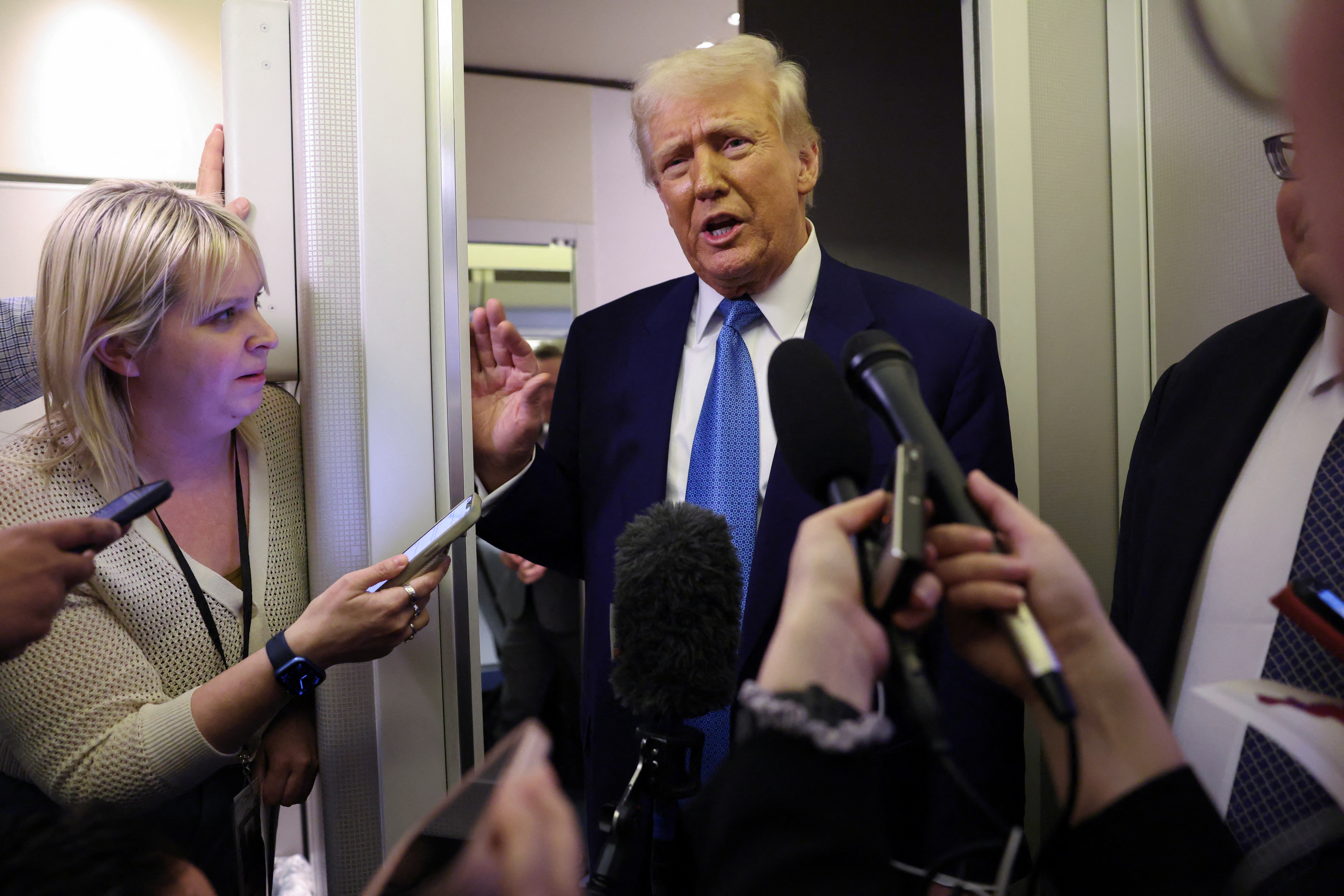 Trump speaks to reporters aboard Air Froce One