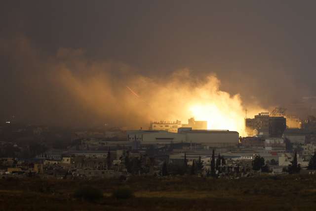Smoke billows after an explosion in northern Gaza