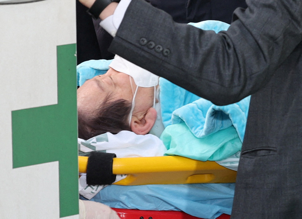 South Korea's opposition Democratic Party leader Lee Jae-myung arrives at Seoul National University Hospital after being stabbed in the neck during his visit to Busan, in Seoul