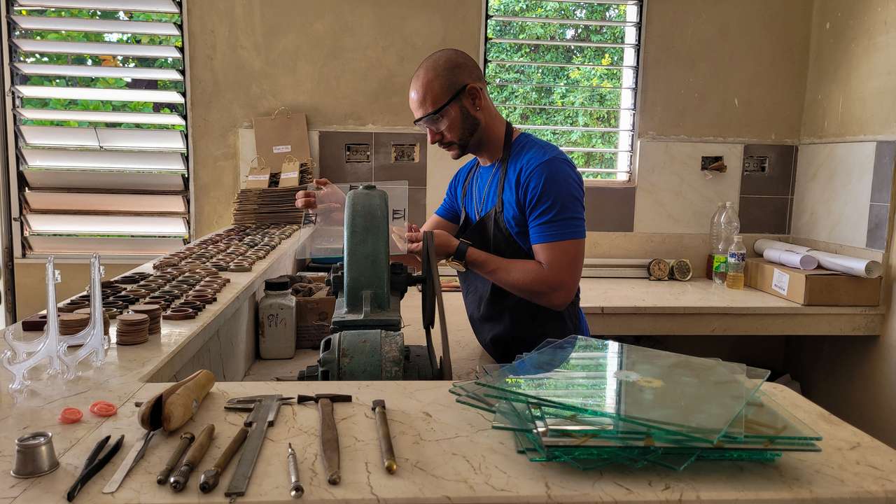 Cuban watchmaker works at a shop in Havana