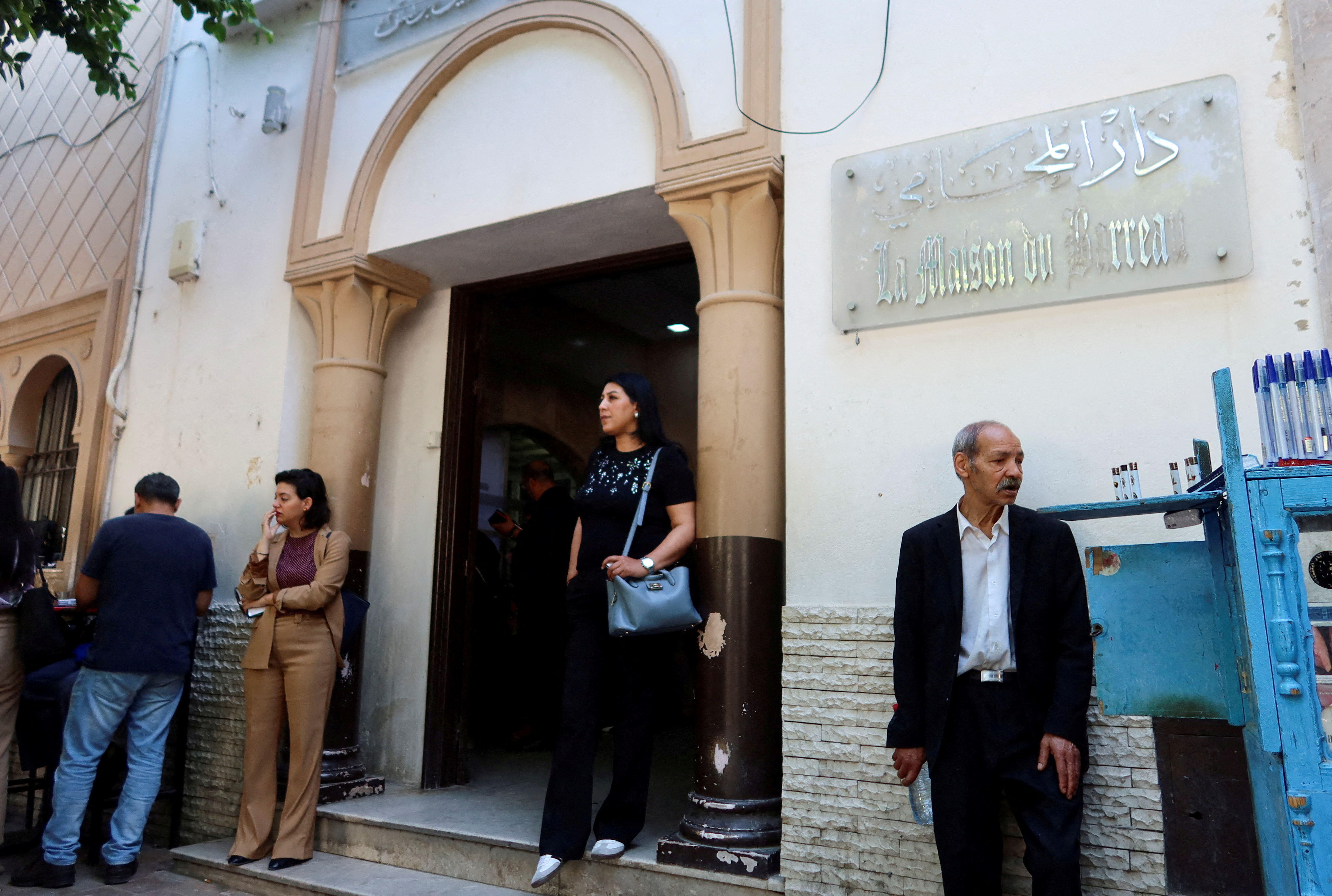 FILE PHOTO: A woman walks out of the building of the Deanship of Lawyers in Tunis