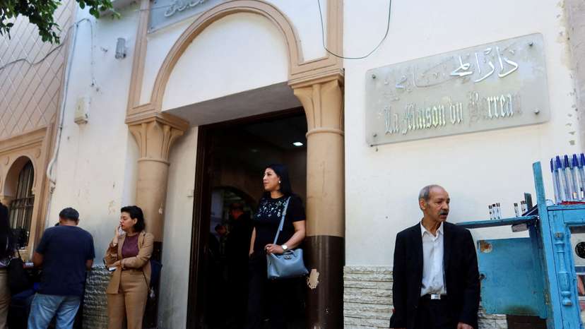 FILE PHOTO: A woman walks out of the building of the Deanship of Lawyers in Tunis