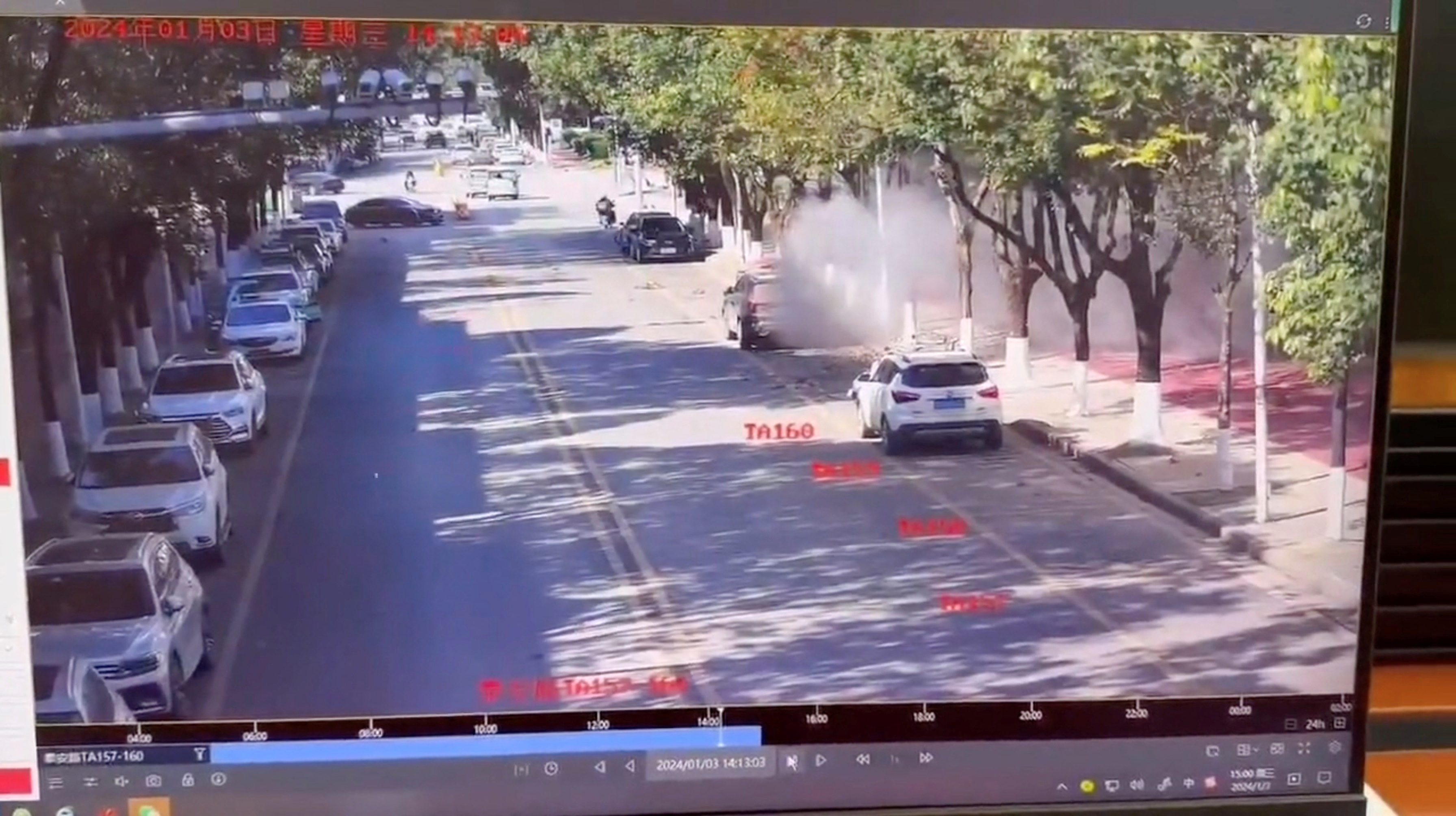 Smoke spreads on a road following an explosion after artillery shells fell in Nansan