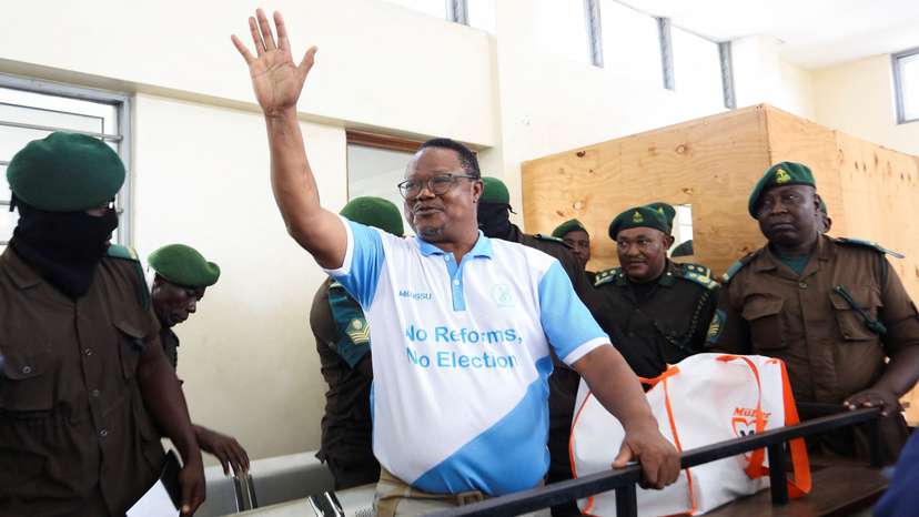 Tanzanian opposition leader and former presidential candidate of CHADEMA party Tundu Lissu waves to supporters at the Kisutu Resident Magistrate Court in Dar es Salaam