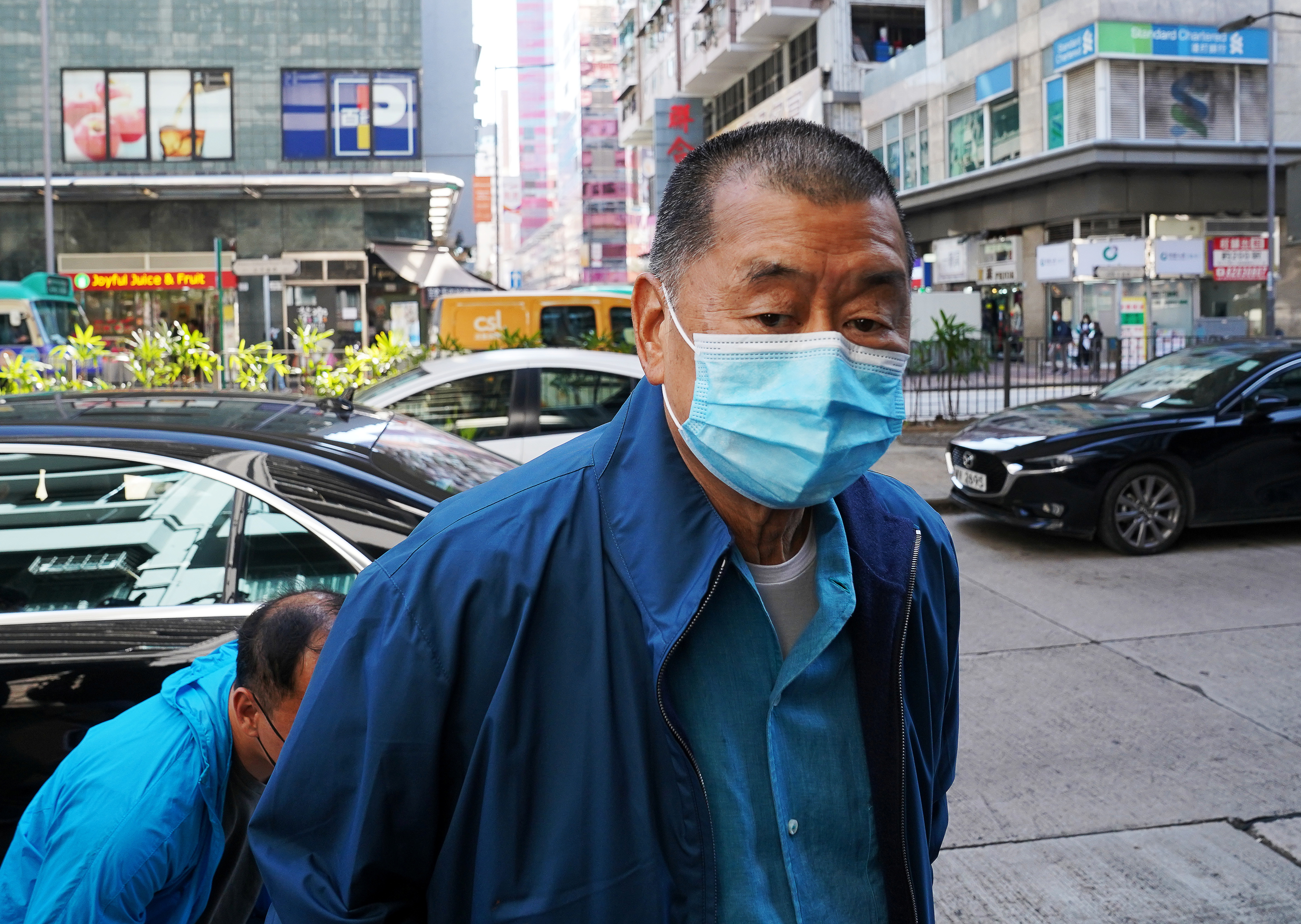 Media mogul Jimmy Lai Chee-ying, founder of Apple Daily, reports to the police station after he was released on bail following his arrest under the national security law in Hong Kong
