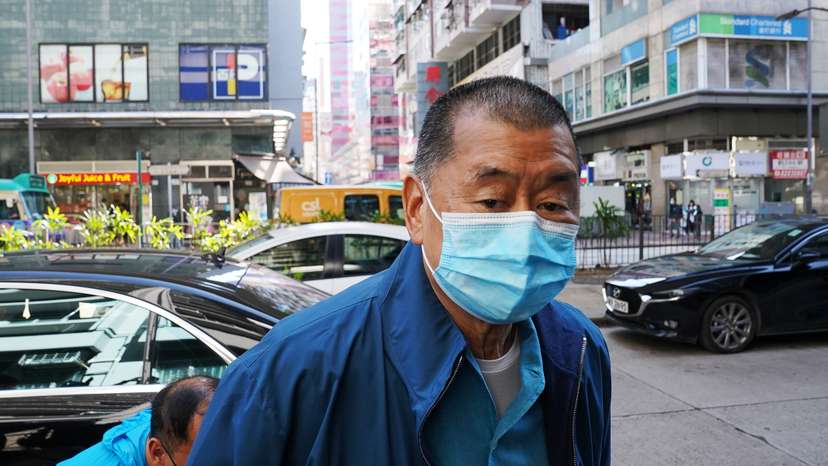 Media mogul Jimmy Lai Chee-ying, founder of Apple Daily, reports to the police station after he was released on bail following his arrest under the national security law in Hong Kong