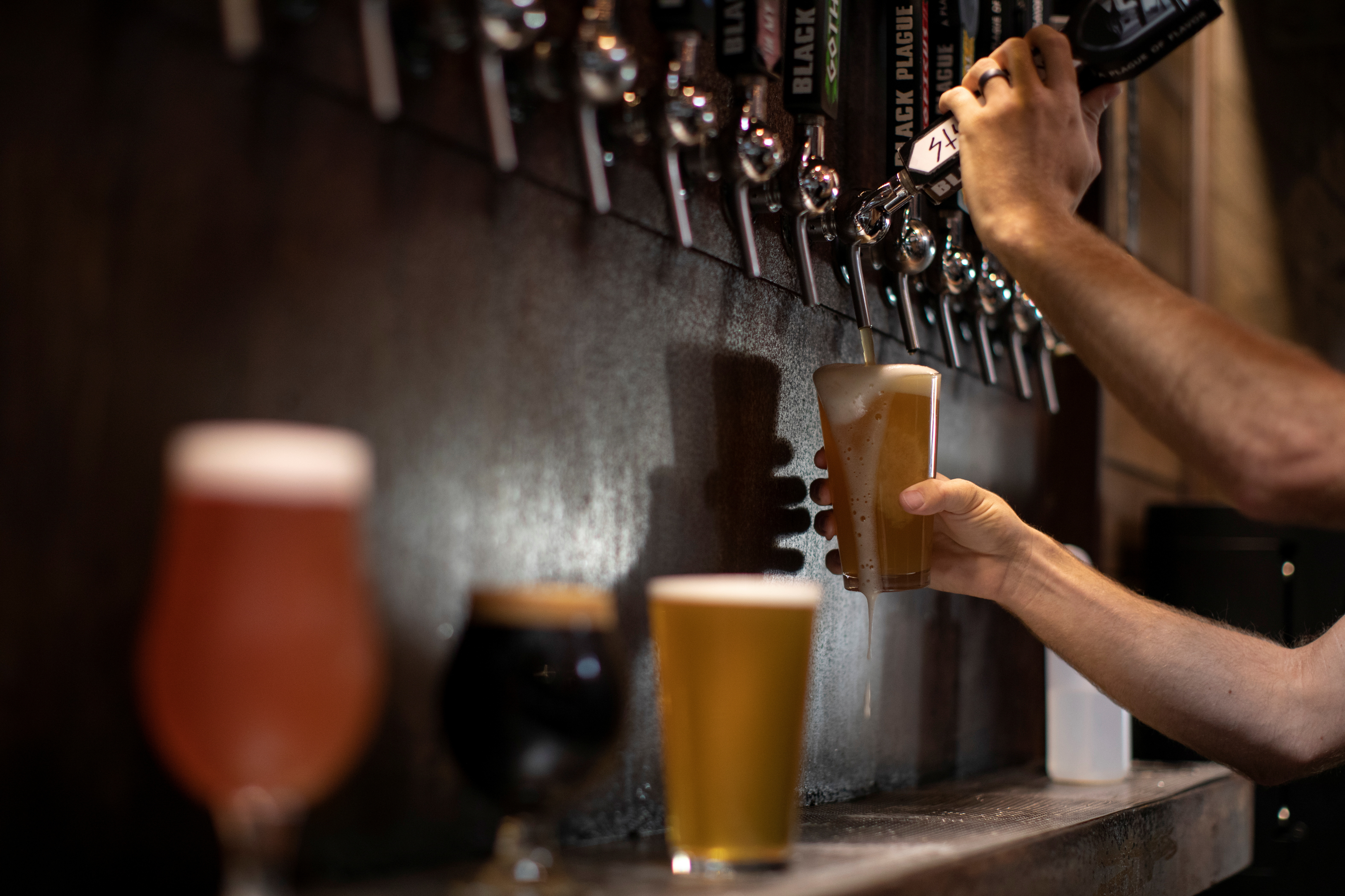 FILE PHOTO: Beer is poured from a tap at a brewery in Oceanside