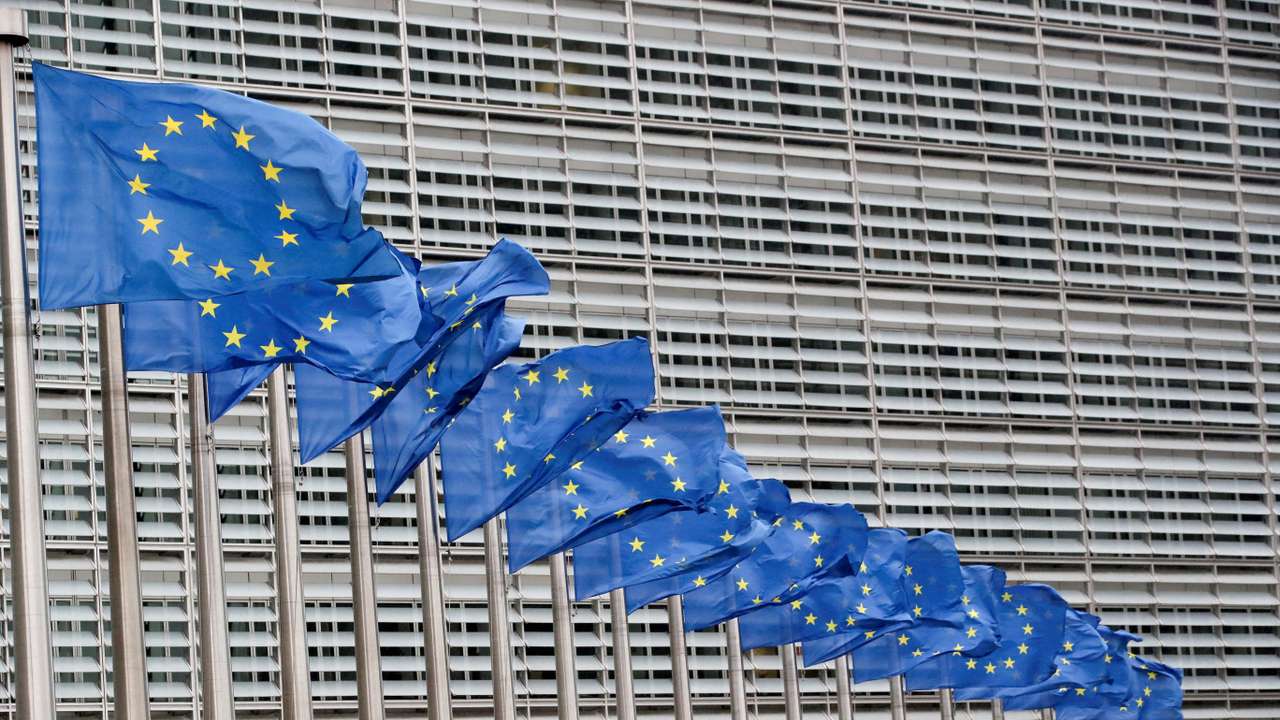 FILE PHOTO: Flags flutter outside EU Commission in Brussels