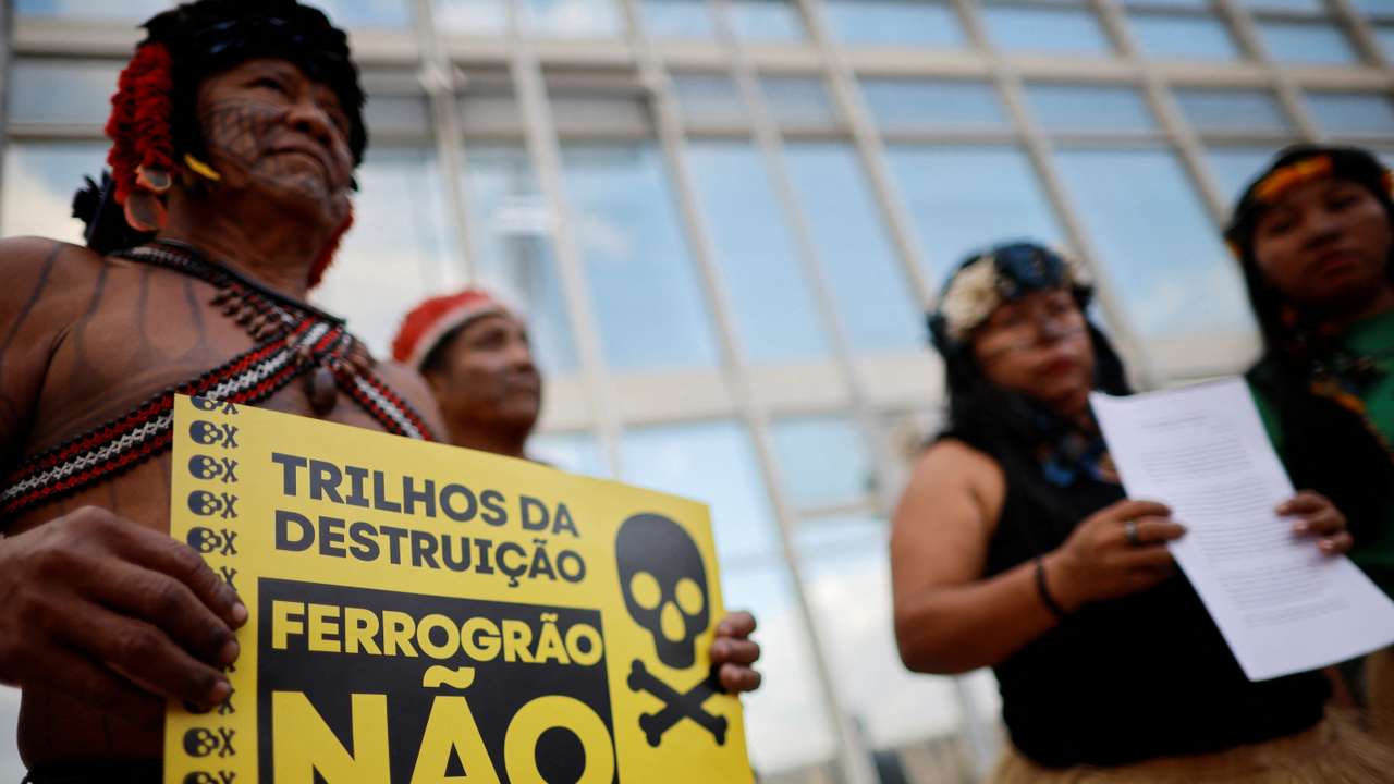 Munduruku Indigenous people stand together before filing a letter of rupture with the Ferrograo railway working group at the Ministry of Transport in Brasilia