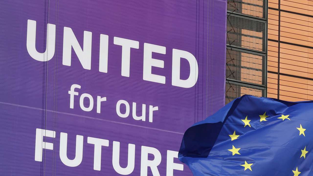 European Union flags flutter outside the European Commission headquarters in Brussels
