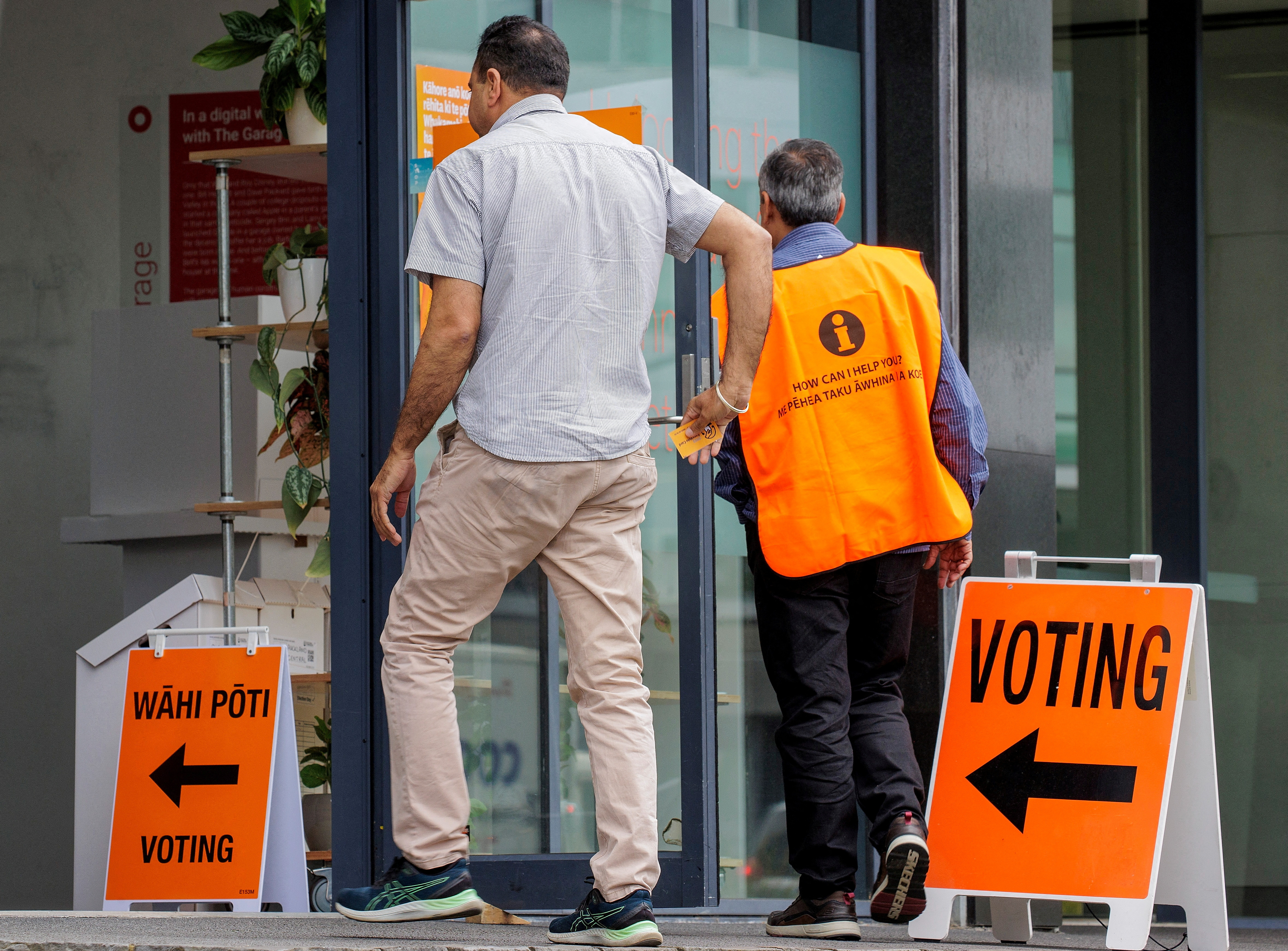 FILE PHOTO: People head to the polls to vote in the general election in Auckland